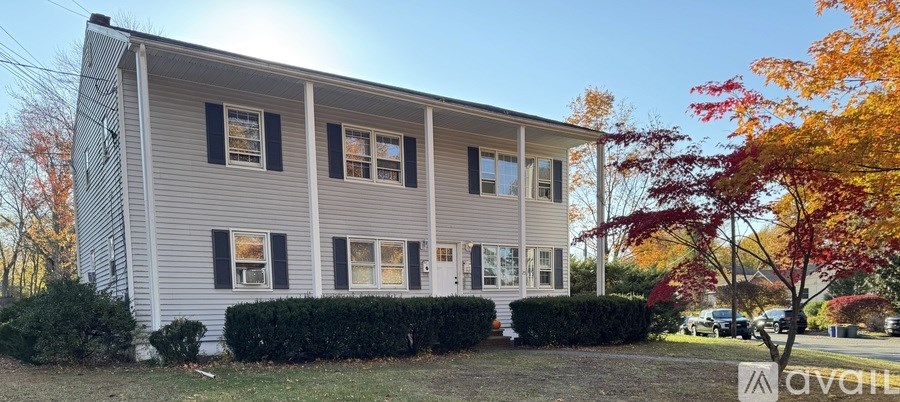 A house with a sign that says "available" in front of it.