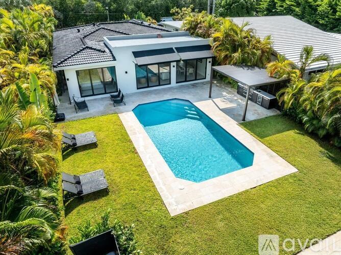 A house with a pool in the backyard.
