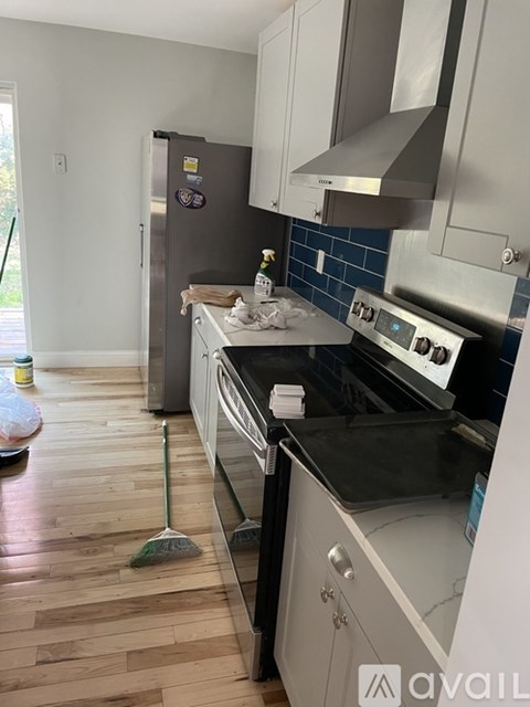 A kitchen with a white fridge and a white stove top oven.