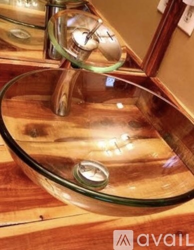 A glass bowl with a ring inside it.