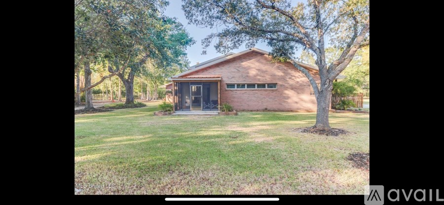 A house with a tree in front of it.