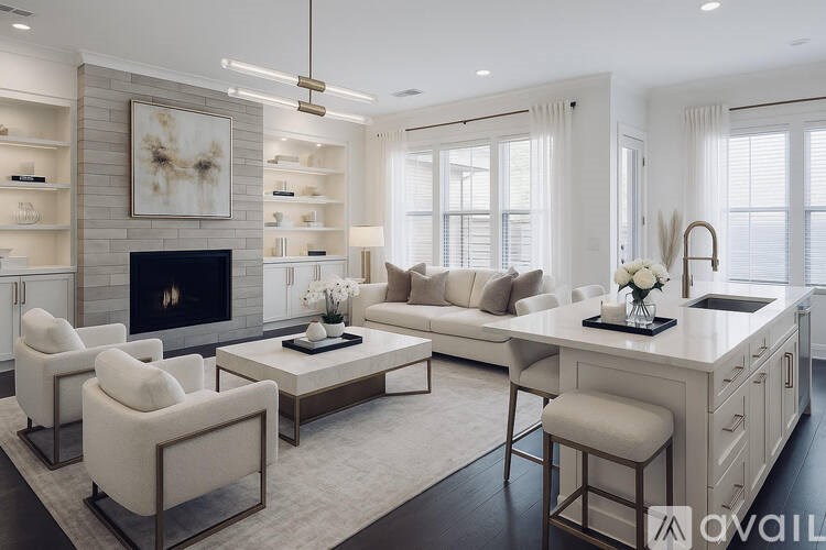 A modern living room with a fireplace and a kitchen area in the background.