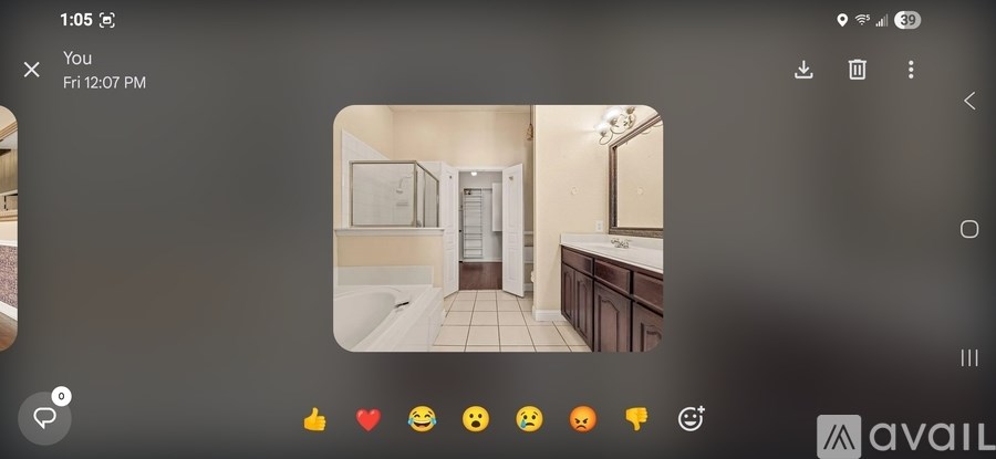 A bathroom with a sink, mirror, and toilet.