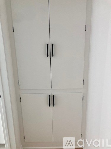 A white cabinet with two doors is shown.