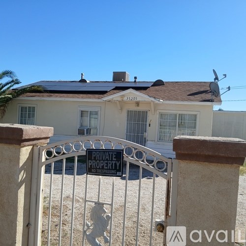 A house with a sign that says "PRIVATE PROPERTY NO TRESPASSING" in front of it.