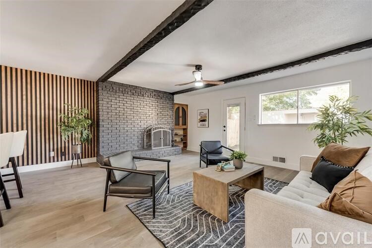 A living room with a fireplace and a couch.