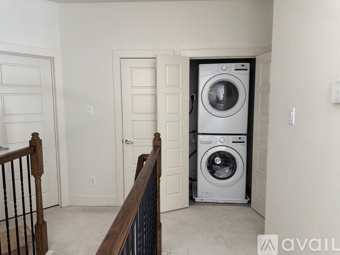 A washer and dryer are in a small laundry room.