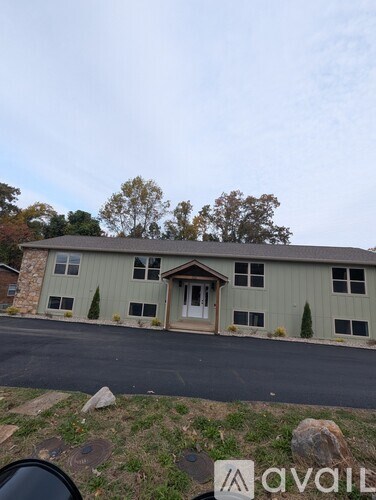 A house with a driveway in front of it.