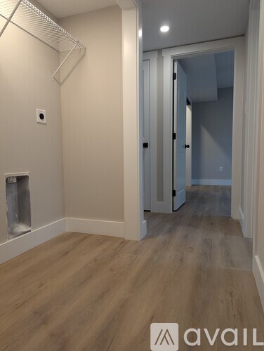 A room with a fireplace and a wooden floor.