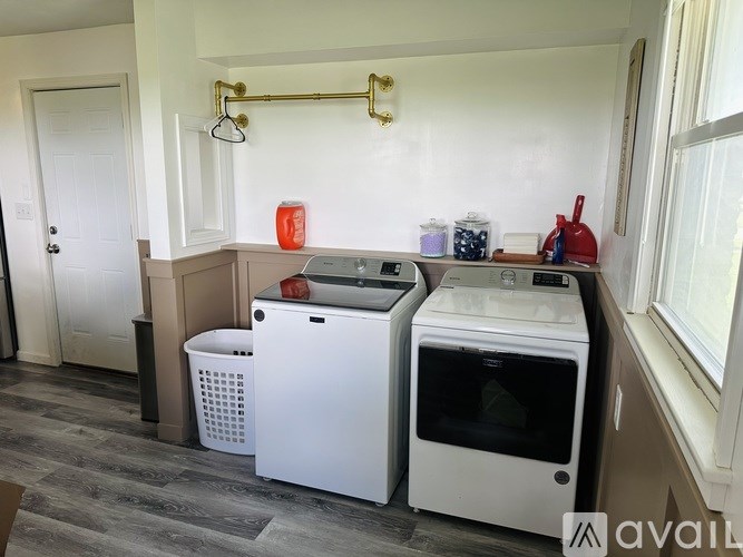 A kitchen with a white dishwasher and a white oven.