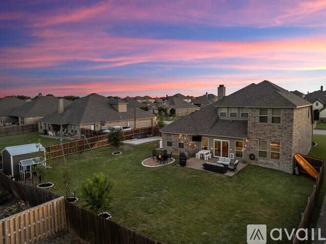 A house with a backyard and a fence.