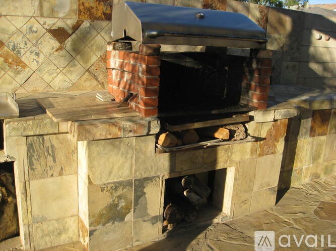 A kitchen with wooden cabinets and a stainless steel oven.