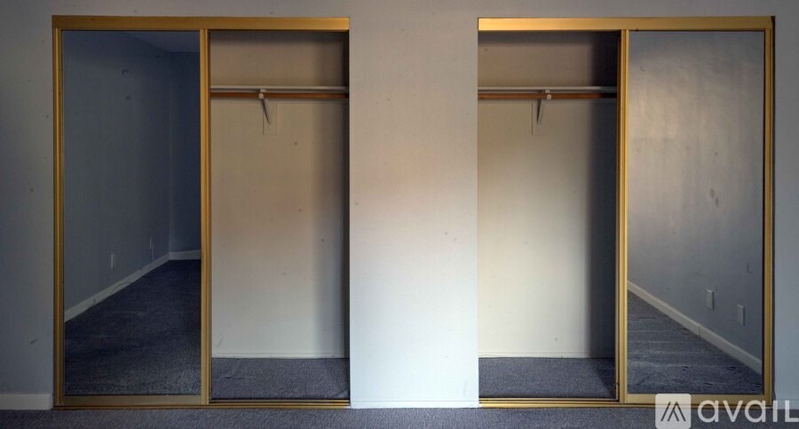 Two mirrors are on the wall.