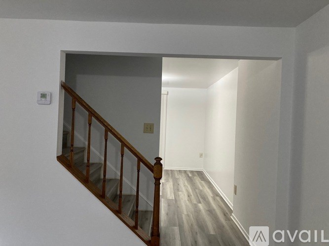 A room with a staircase leading to the second floor.