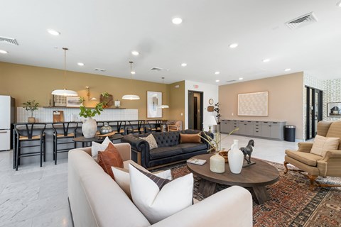 A living room with a white sofa and a coffee table.