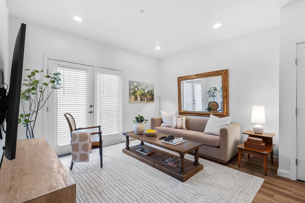 A living room with a couch, chair, and coffee table.