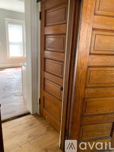 A wooden door with a handle is closed.