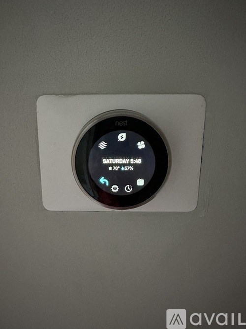 A thermostat shows the temperature is 67 degrees.