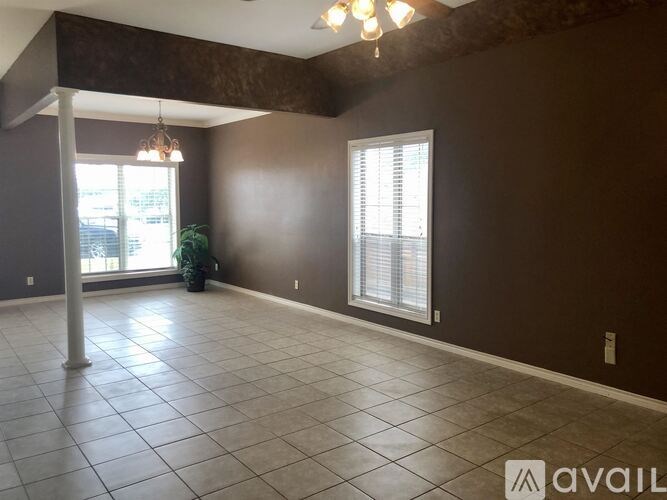 A room with brown walls and a tiled floor.