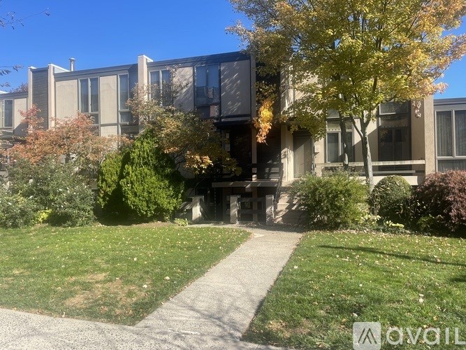 A modern building with a tree in front of it.