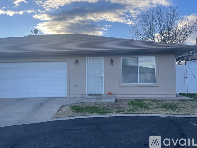A house with a garage door and a window is available for rent.