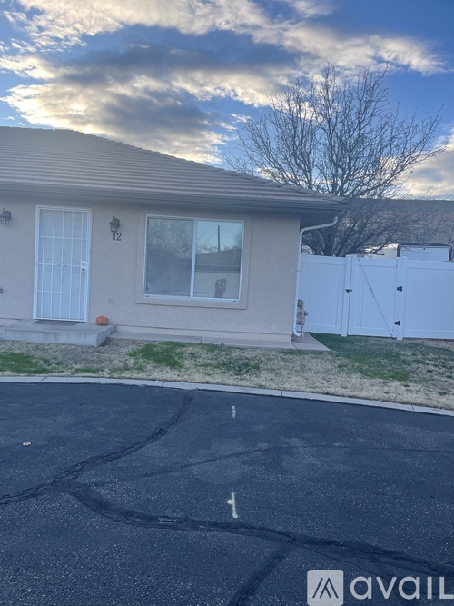 A house with a driveway in front of it.