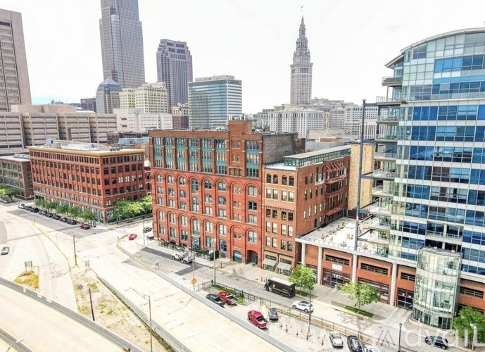 A city street with cars and buildings.