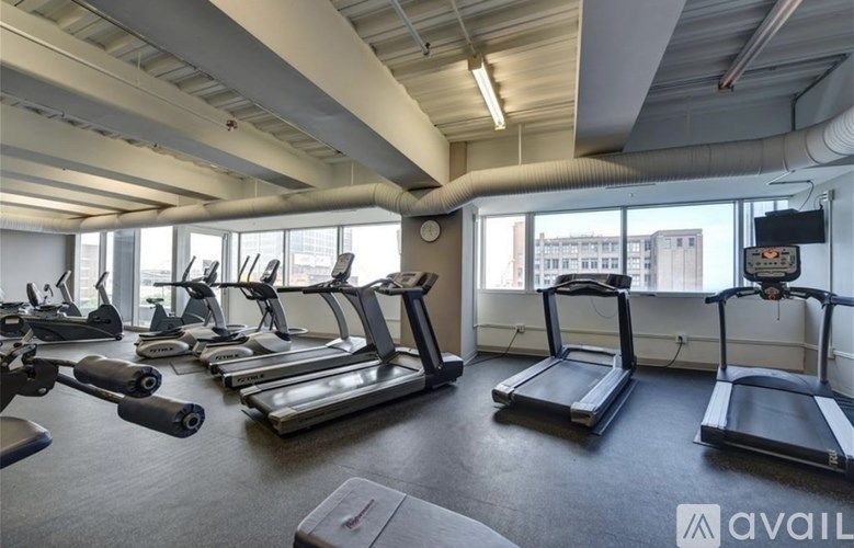 A gym with treadmills and elliptical machines.