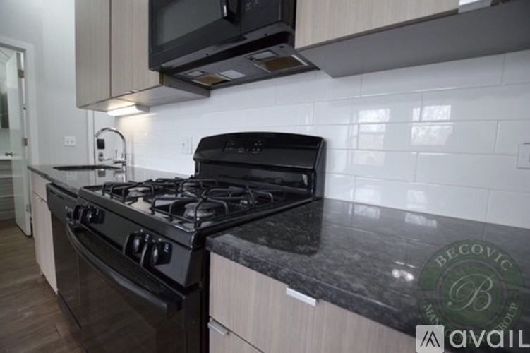 A black stove top oven sitting on a counter in a kitchen.