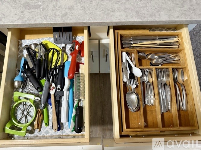 A drawer full of utensils and kitchen tools.
