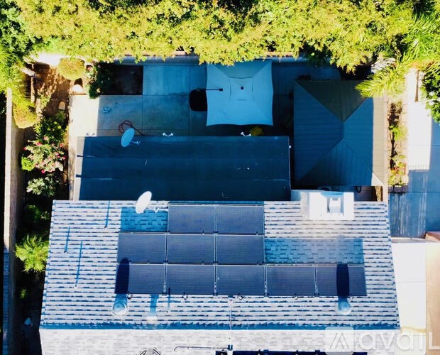 A rooftop with solar panels installed.