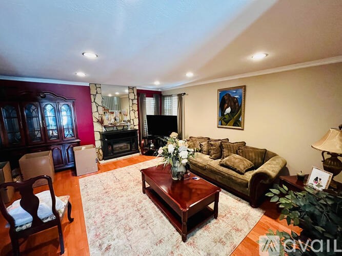 A living room with a fireplace and a couch.