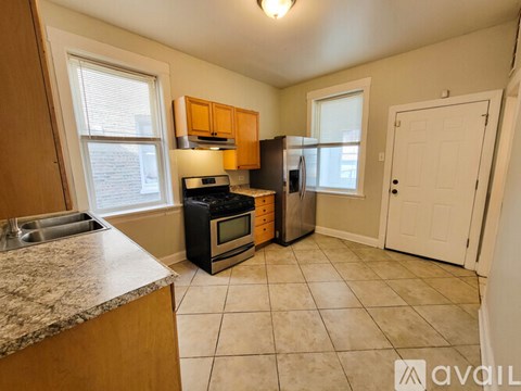 A kitchen with a granite countertop and a sink.