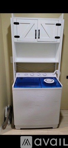 A white cabinet with a blue drawer is available for purchase.