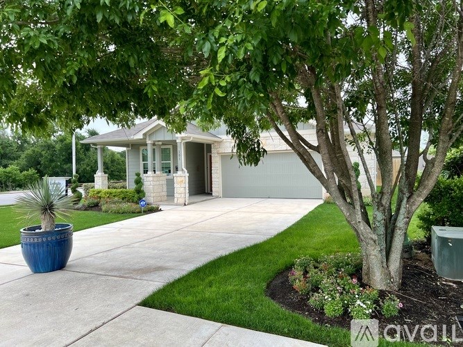 A house with a tree in front of it.