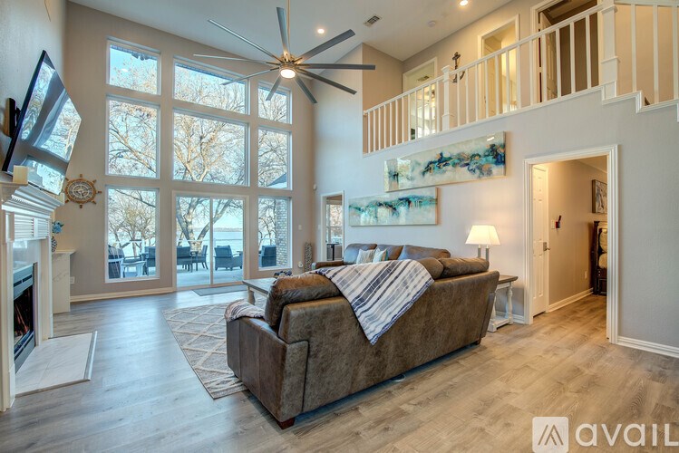 A living room with a couch and a fireplace.