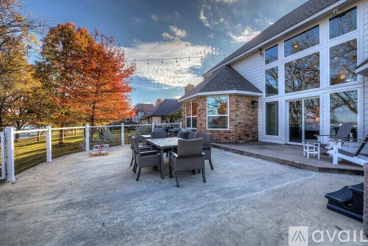A house with a patio and a table set for four.