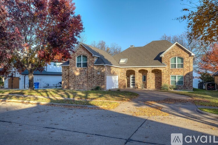A house with a driveway in front of it is for sale.
