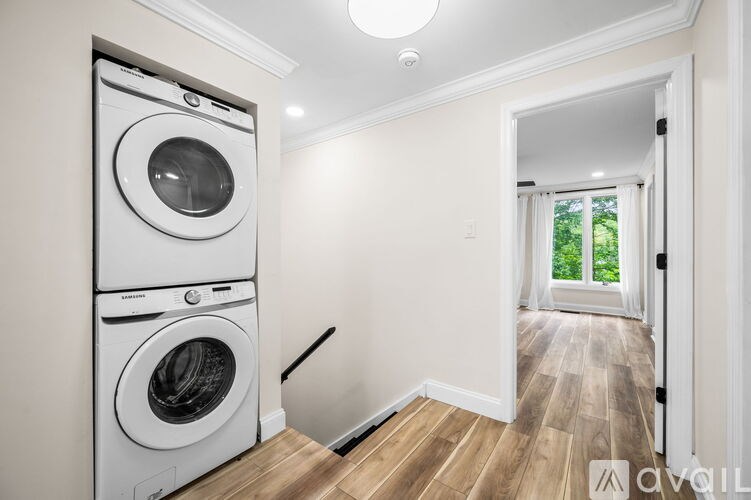 A white washer and dryer in a laundry room.