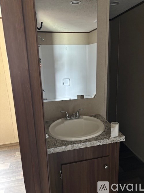 A bathroom sink with a mirror above it.