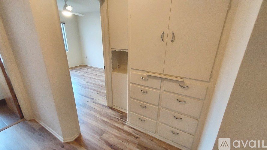 A room with a cabinet and drawers in it.