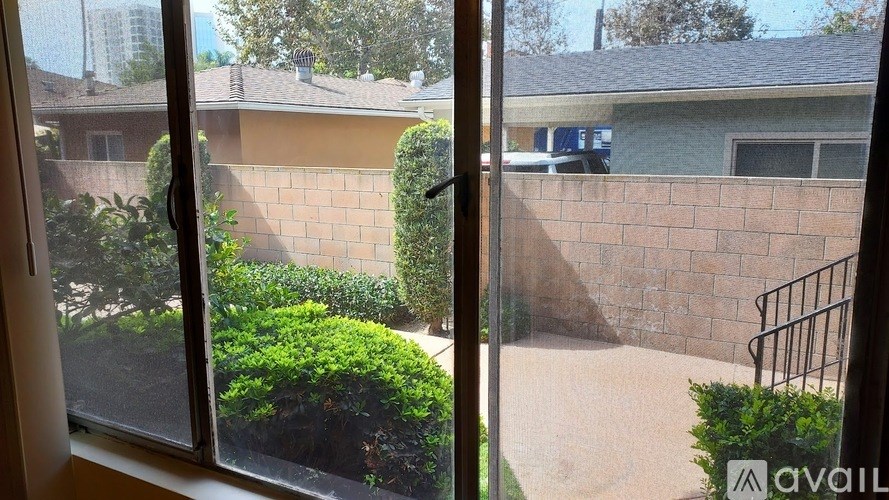 A view from a window looking out to a residential area.