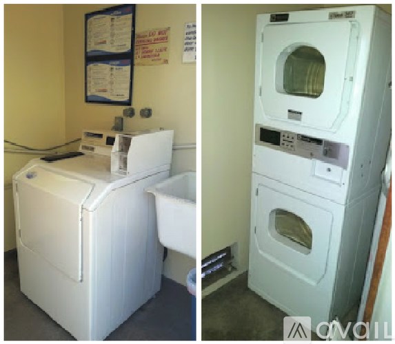 A white washing machine and dryer in a small room.