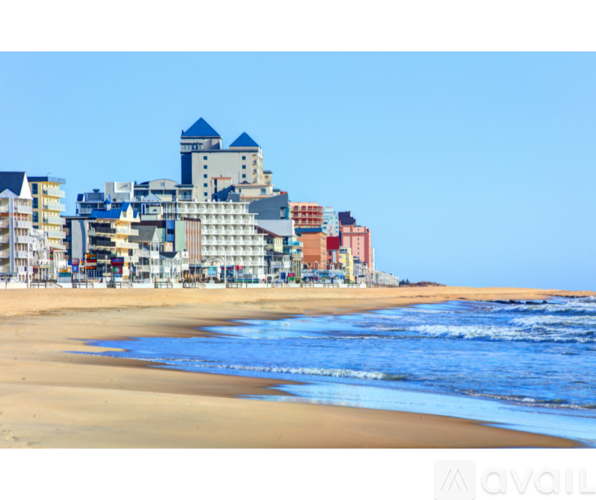 A beach with buildings in the background.
