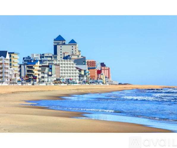 A beach with buildings in the background.