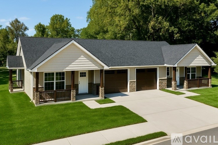 A house with a garage and a driveway is available for sale.