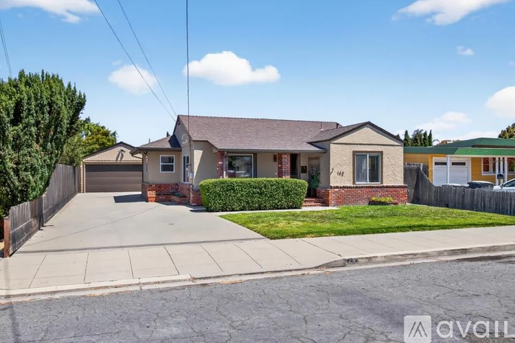 A house with a driveway in front of it.