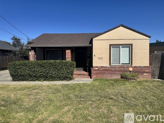 A house with the number 143 on it.