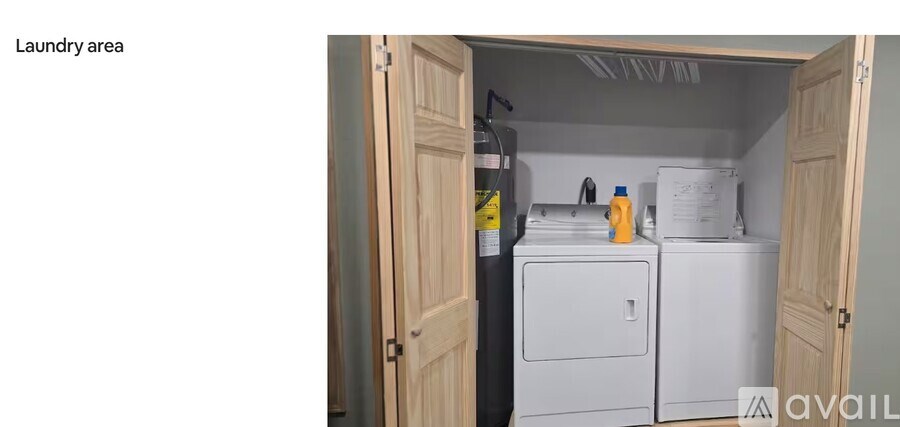 A small laundry area with a washer and dryer.
