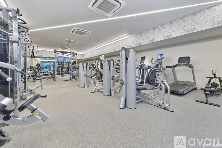 A well-equipped gym with various exercise machines and equipment.